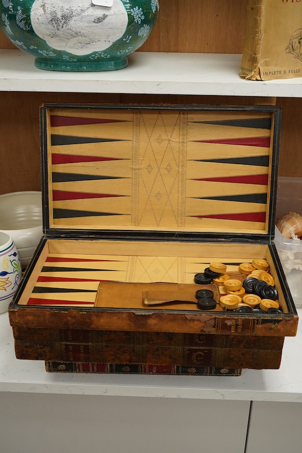 Three late 19th/early 20th century folding chess/backgammon boards fashioned as books